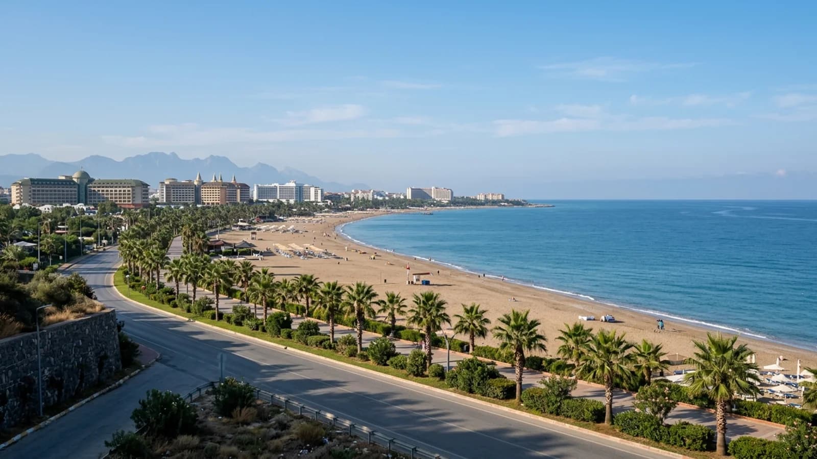 An Antalya airport taxi to Lara Beach hotels takes you to this long sandy beach, palm-lined promenade, and resort buildings.